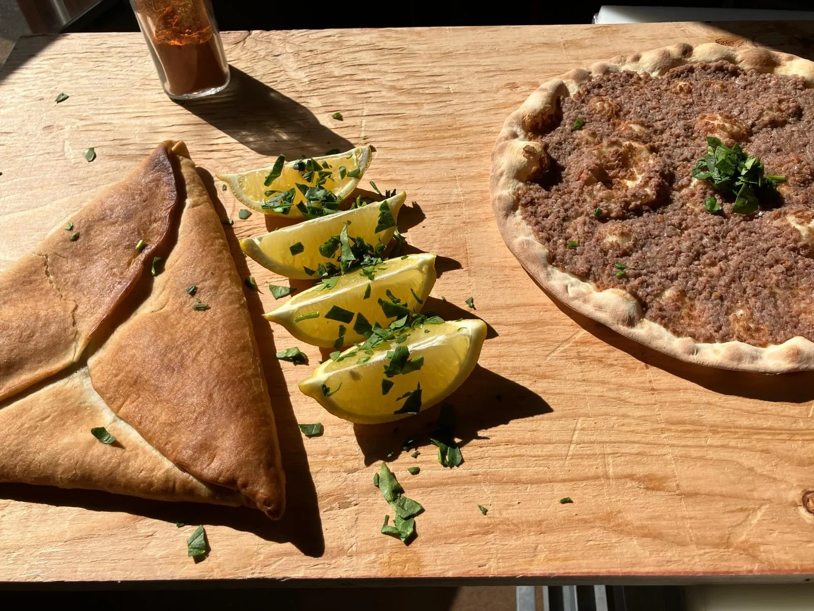 Lebanese catering spread with fatayer and lahmacun