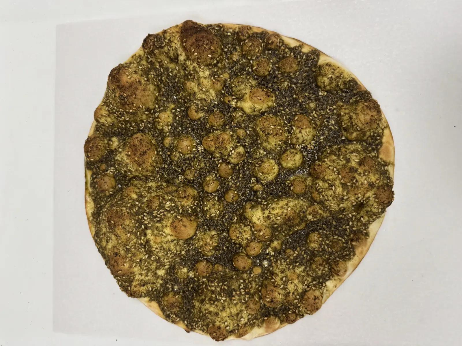 Fresh zaatar manoushe at Adonis Market